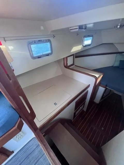 Slide: The Image of Interior of 1989 Blue Seas Out Island Explorer boat with wood accents and cozy cabin space. - 35
