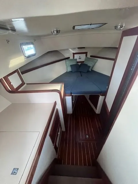 Slide: The Image of 1989 Blue Seas Out Island Explorer cabin with cozy bed and wooden flooring. - 36