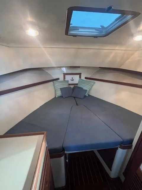 Slide: The Image of Cozy cabin interior of 1989 Blue Seas Out Island Explorer with skylight and cushions. - 37
