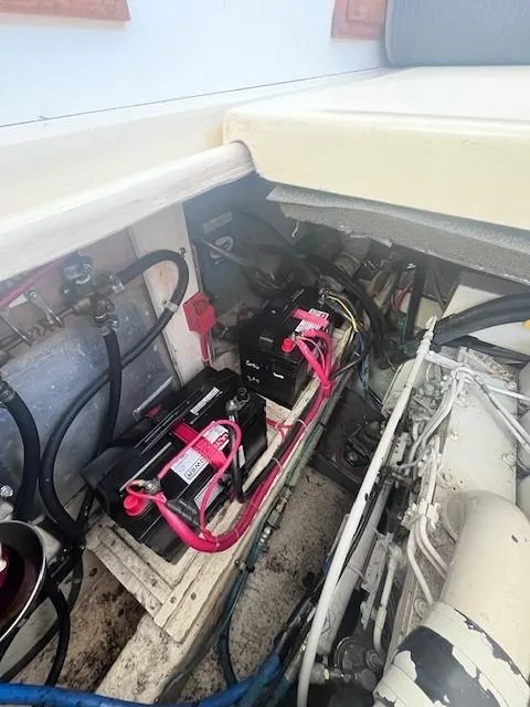 Slide: The Image of Engine compartment of 1989 Blue Seas Out Island Explorer with visible wiring and components. - 44