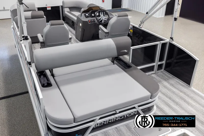 Slide: The Image of 2025 Bennington 21 SSBSE pontoon boat interior with gray seating and modern dashboard. - 11