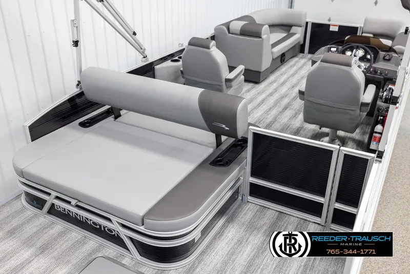 Slide: The Image of 2025 Bennington 21 SSBSE pontoon boat interior with gray seating and modern design. - 12