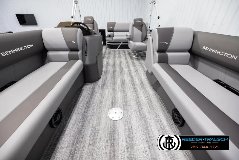 Slide: The Image of Interior of 2025 Bennington 21 SSBSE pontoon boat with gray seating and modern design. - 13
