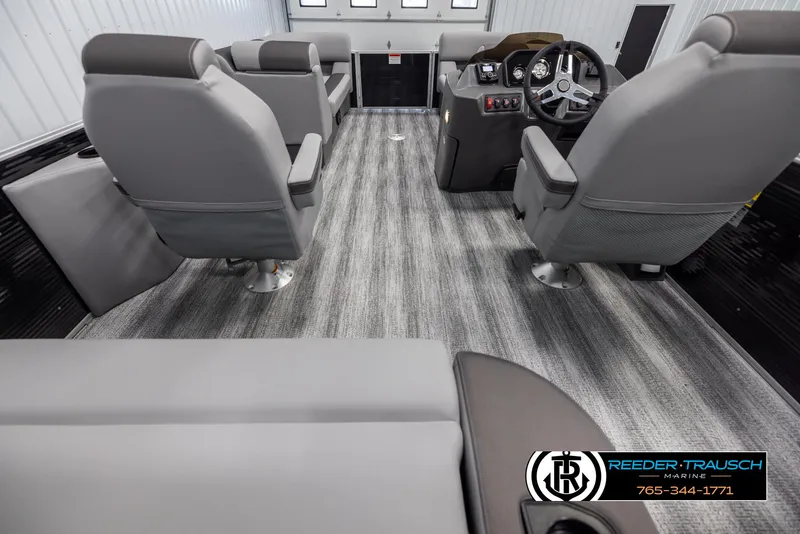 Slide: The Image of Interior of 2025 Bennington 21 SSBSE boat with gray seating and modern dashboard. - 16