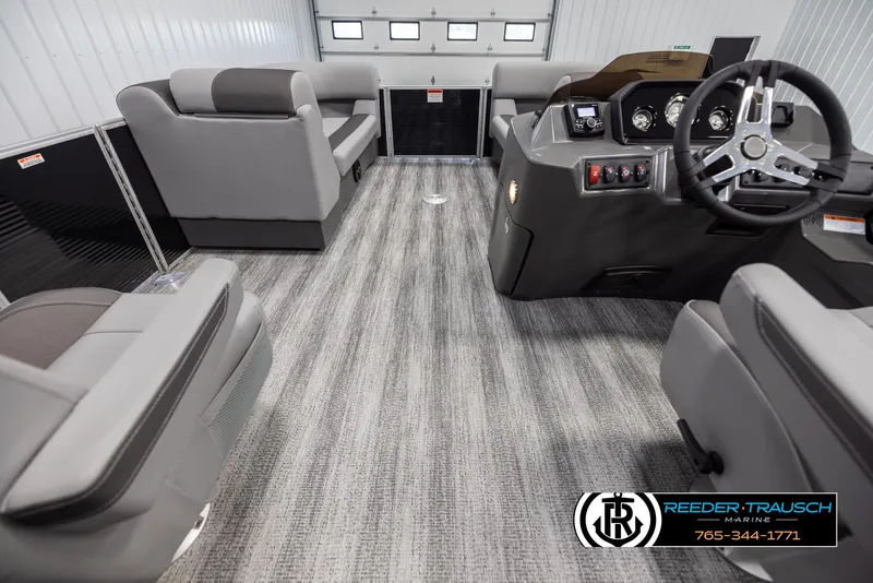 Slide: The Image of Interior of 2025 Bennington 21 SSBSE pontoon boat with modern seating and steering console. - 17