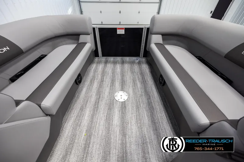 Slide: The Image of 2025 Bennington 21 SSBSE boat interior with gray seating and carpeted flooring. - 18