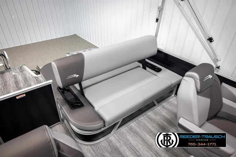 Slide: The Image of 2025 Bennington 21 SSBSE pontoon boat interior with gray seating and cup holders. - 21