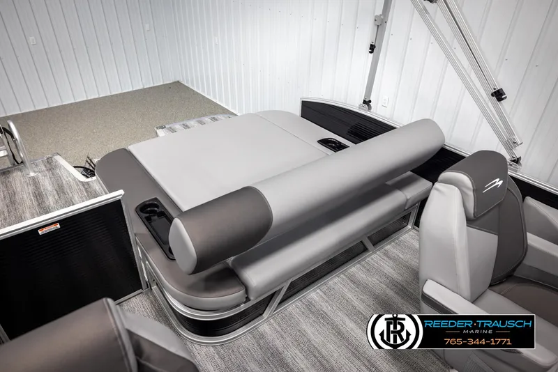 Slide: The Image of 2025 Bennington 21 SSBSE pontoon boat interior with gray seating and modern design. - 22