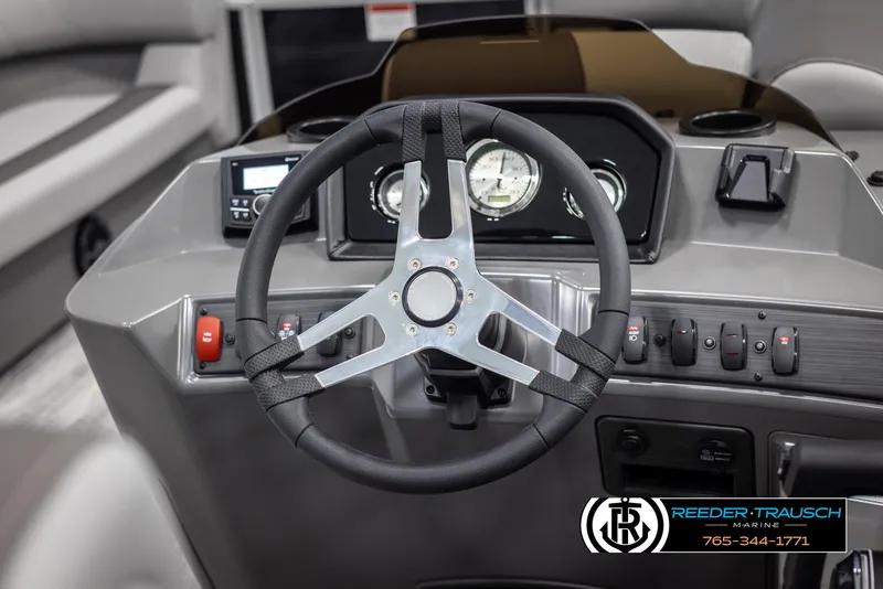 Slide: The Image of 2025 Bennington 21 SSBSE boat dashboard with steering wheel and control panel. - 24