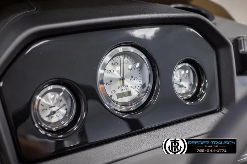 Slide: The Image of Dashboard of 2025 Bennington 21 SSBSE boat with gauges and Reeder-Trausch Marine logo. - 29