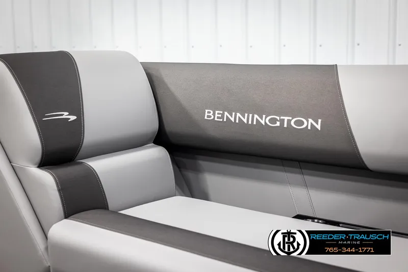 Slide: The Image of 2025 Bennington 21 SSBSE boat seat with logo, featuring sleek gray upholstery. - 34