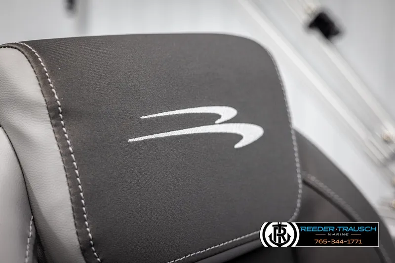 Slide: The Image of Close-up of 2025 Bennington 21 SSBSE boat seat with logo and Reeder-Trausch Marine contact. - 37