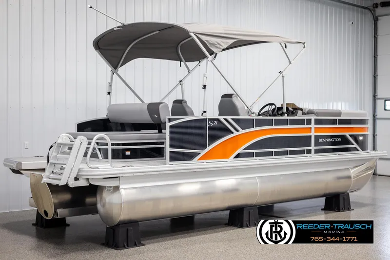 Slide: The Image of 2025 Bennington 21 SSBSE pontoon boat with canopy in showroom. - 6