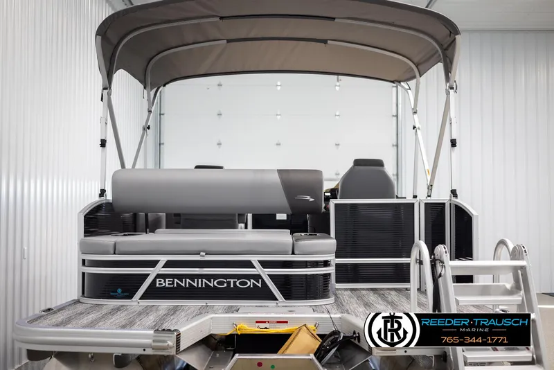 Slide: The Image of 2025 Bennington 21 SSBSE pontoon boat with canopy in showroom. - 7