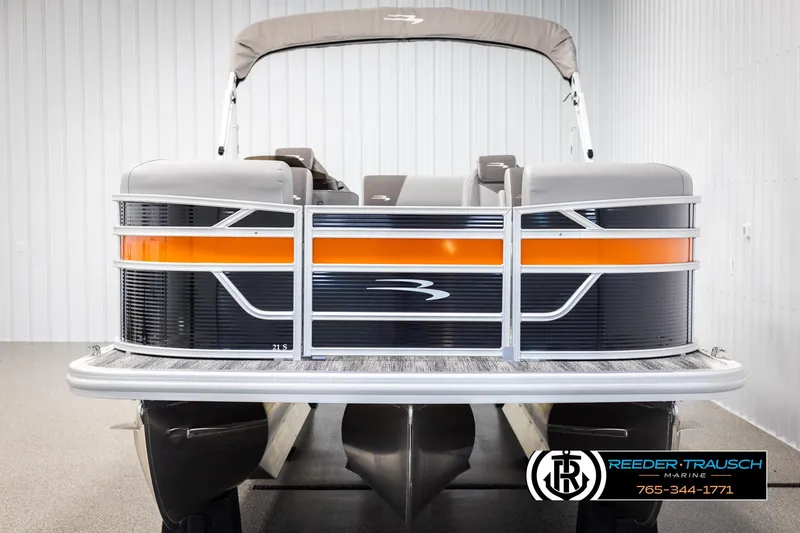 Slide: The Image of 2025 Bennington 21 SSBSE pontoon boat with orange accents in a showroom. - 8