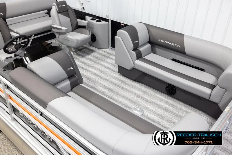 Slide: The Image of 2025 Bennington 21 SSBSE pontoon boat interior with gray seating and steering console. - 9