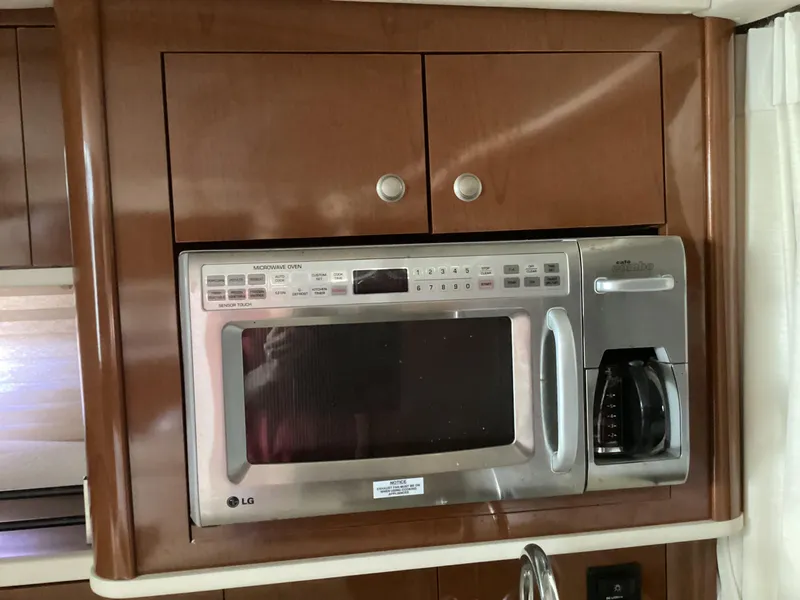 Slide: The Image of LG microwave and coffee maker in 2008 Sea Ray 350 Sundancer yacht kitchen. - 17