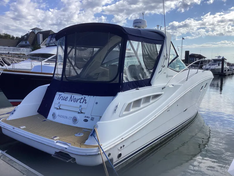 Slide: The Image of 2008 Sea Ray 350 Sundancer docked at marina under cloudy sky. - 2