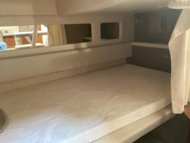 Slide: The Image of Interior cabin of 2008 Sea Ray 350 Sundancer with bed and windows. - 20