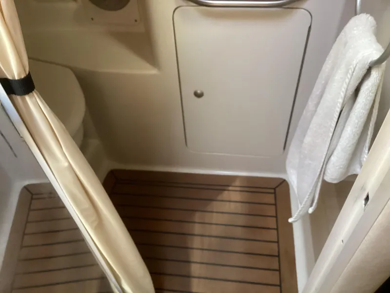 Slide: The Image of 2008 Sea Ray 350 Sundancer bathroom with wooden floor and towel rack. - 21