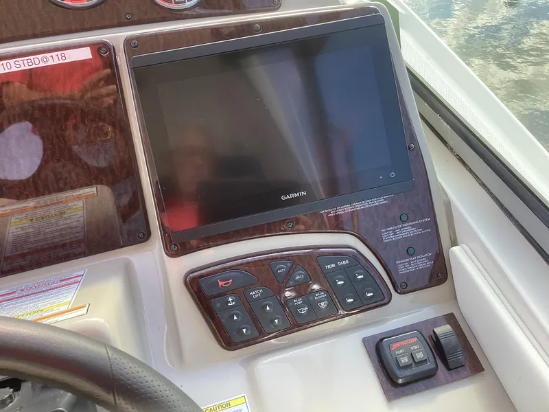 Slide: The Image of Control panel of 2008 Sea Ray 350 Sundancer with Garmin display and navigation controls. - 6