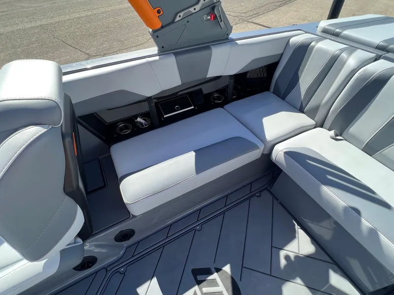 Slide: The Image of 2023 Malibu Wake Setter LSV 22 interior with gray seating and modern design. - 16