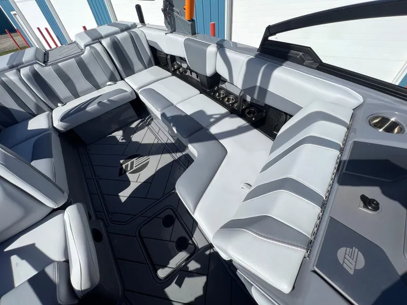 Slide: The Image of 2023 Malibu Wake Setter LSV 22 interior with sleek gray seating and modern design. - 19