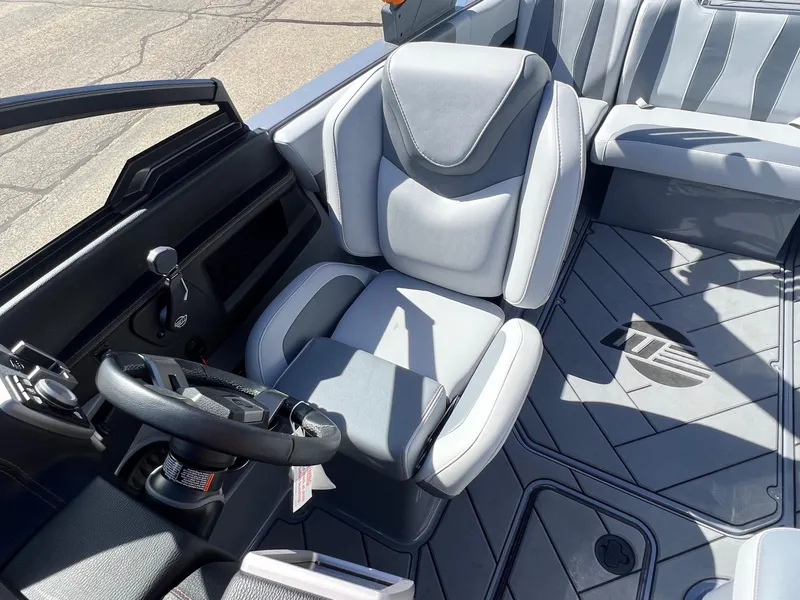 Slide: The Image of 2023 Malibu Wake Setter LSV 22 interior with sleek gray seating and modern dashboard. - 21