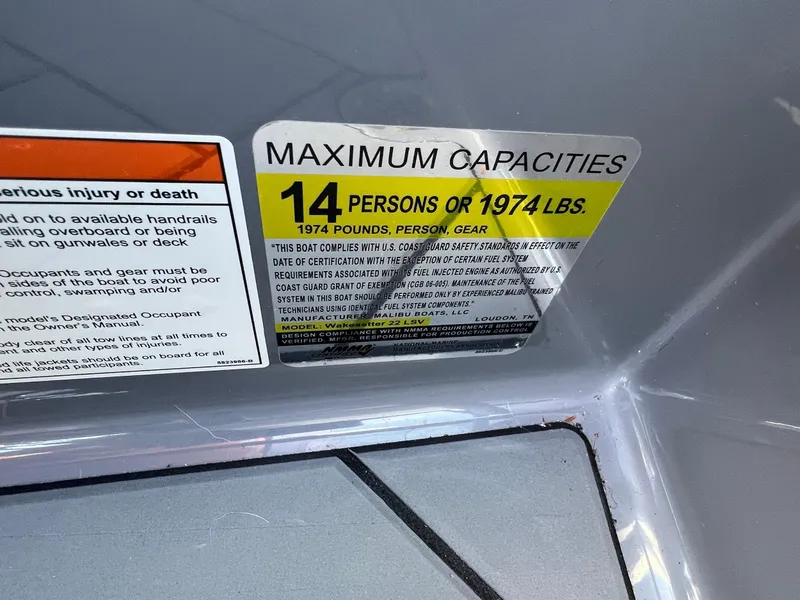 Slide: The Image of 2023 Malibu Wake Setter LSV 22 capacity label: 14 persons or 1974 lbs maximum. - 28