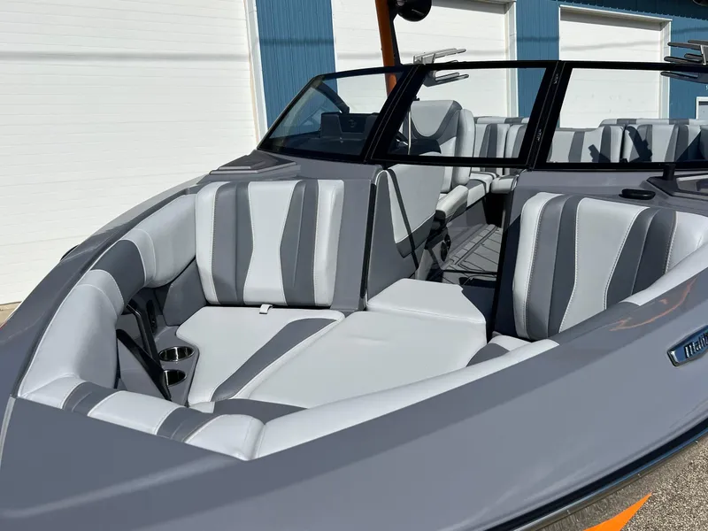 Slide: The Image of 2023 Malibu Wake Setter LSV 22 boat with sleek gray and white interior design. - 33