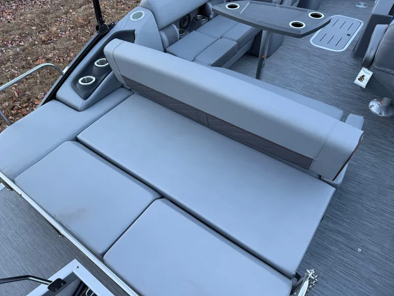 Slide: The Image of 2023 Bennington 21LSB boat interior with gray seating and cup holders. - 20