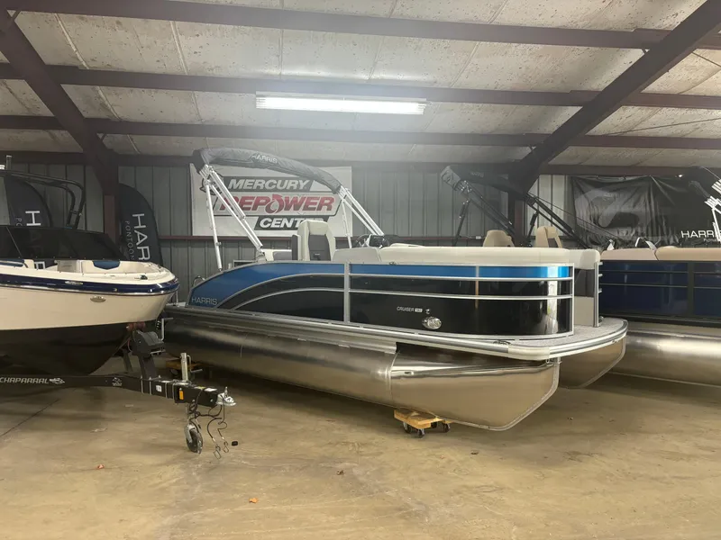 The Image of 2025 Harris Cruiser 190 pontoon boat in indoor storage. - 0