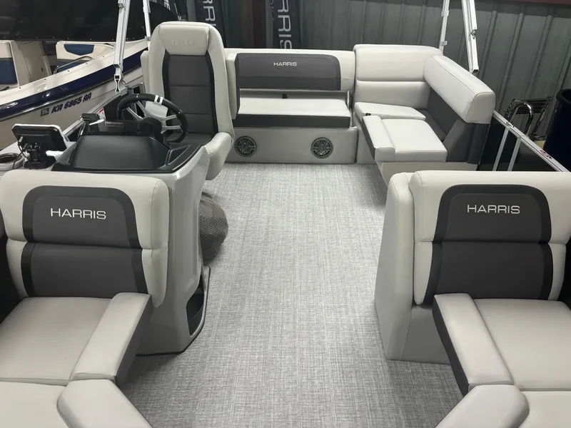 Slide: The Image of 2025 Harris Cruiser 190 boat interior with gray seating and modern design. - 3