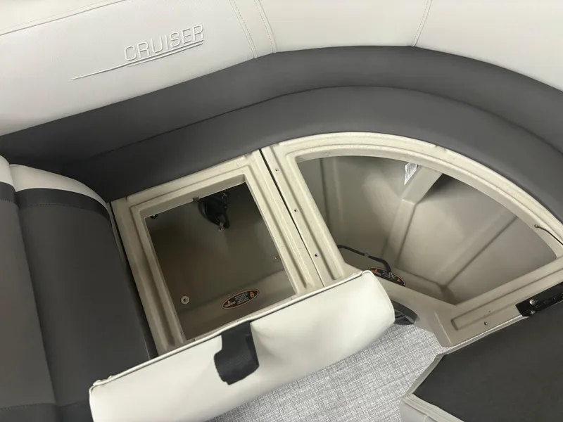 Slide: The Image of 2025 Harris Cruiser 190 boat interior with open storage compartments. - 4