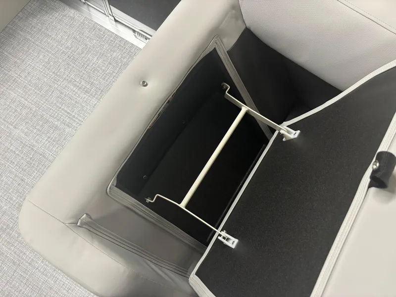 Slide: The Image of 2025 Harris Cruiser 190 boat storage compartment with open lid and organizer. - 5