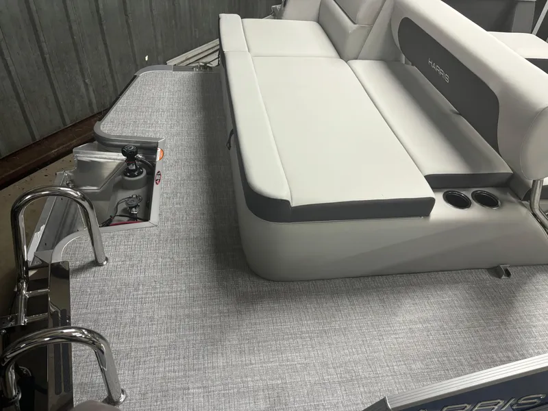 Slide: The Image of 2025 Harris Cruiser 190 boat interior with gray seating and deck. - 8