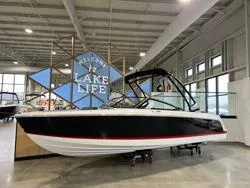 Slide: The Image of 2024 Cobalt CS23 boat displayed indoors with "Welcome to Lake Life" sign. - 11