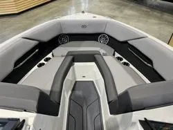 Slide: The Image of 2024 Cobalt CS23 boat interior with gray seating and modern design. - 4