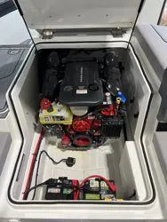Slide: The Image of 2024 Cobalt CS23 boat engine compartment with visible components and wiring. - 5