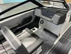 Slide: The Image of 2024 Cobalt CS23 boat interior with modern seating and dashboard design. - 6
