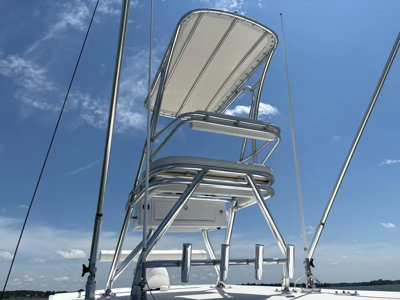 Slide: The Image of 2016 Invincible 42 Open Fisherman boat tower against blue sky. - 12