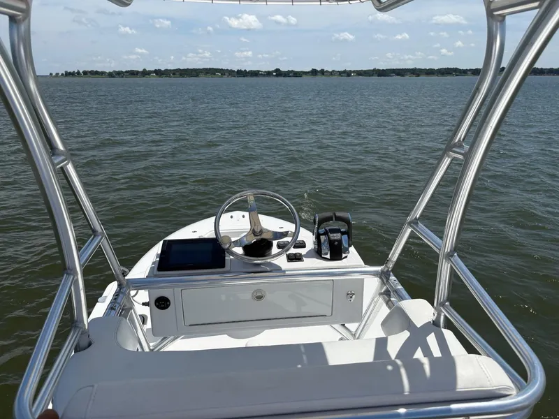 Slide: The Image of 2016 Invincible 42 Open Fisherman boat helm with ocean view. - 13