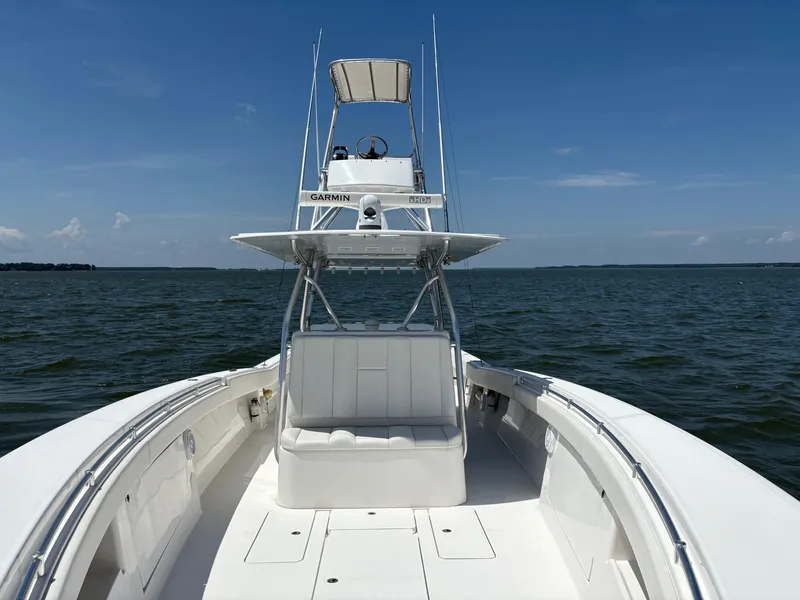 Slide: The Image of 2016 Invincible 42 Open Fisherman boat on open water under clear blue sky. - 8