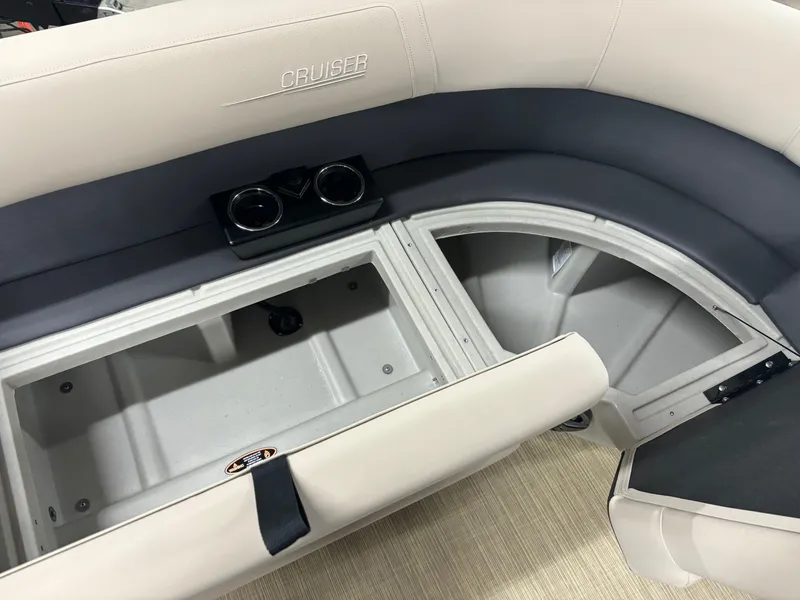 Slide: The Image of 2025 Harris Cruiser 230 boat seating with storage compartment and cup holders. - 3