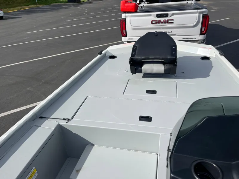 Slide: The Image of 2025 Crestliner 1600 Storm boat on trailer, parked behind a GMC truck. - 5