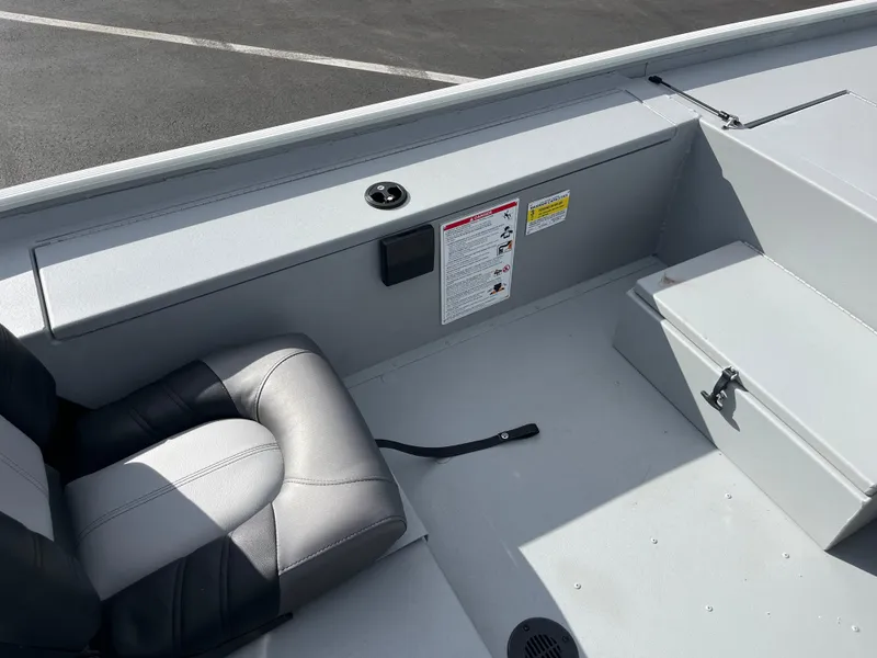 Slide: The Image of 2025 Crestliner 1600 Storm boat interior with seating and storage compartments. - 6