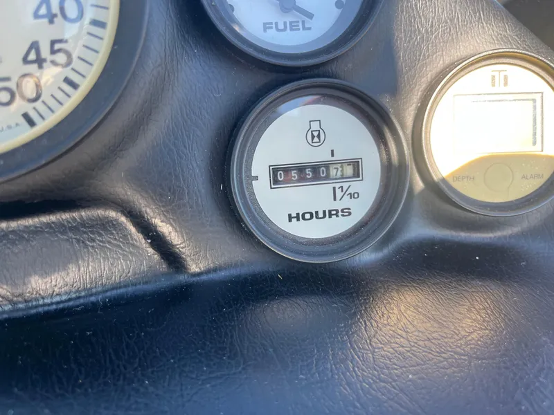 Slide: The Image of 1995 Correct Craft Ski Nautique dashboard with hour meter reading 550.7 hours. - 4