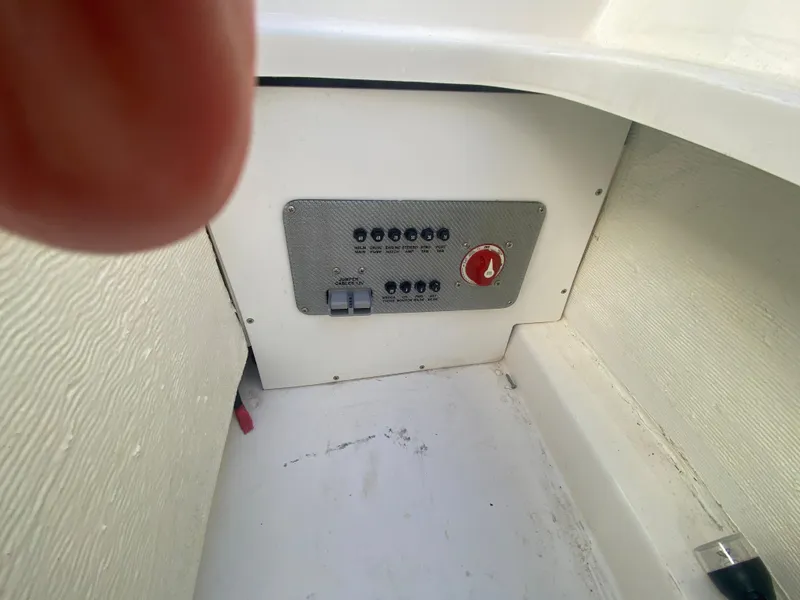 Slide: The Image of Control panel of a 2019 Baja 24 Outlaw boat interior. - 10