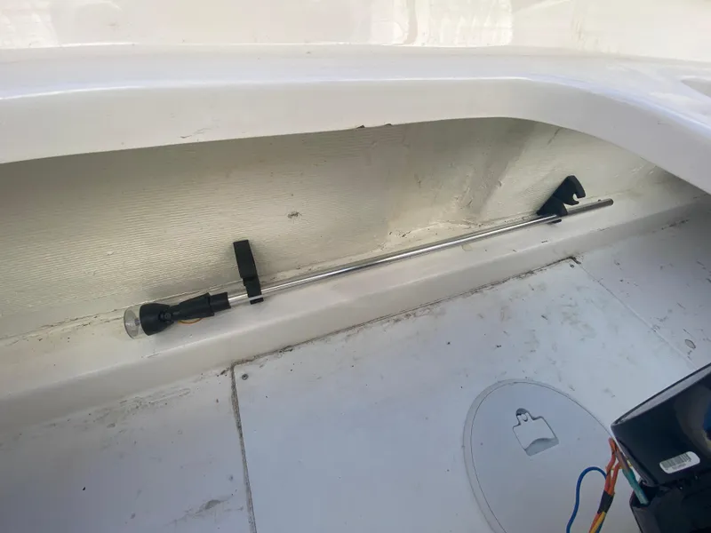 Slide: The Image of 2019 Baja 24 Outlaw boat interior with mounted rod holder. - 11