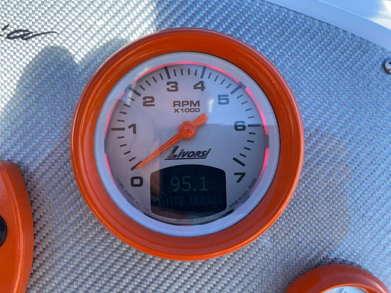 Slide: The Image of Tachometer of 2019 Baja 24 Outlaw showing 95.1 hours, orange trim. - 13